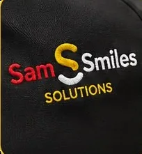 An embroidered Sam Smiles logo on fabric